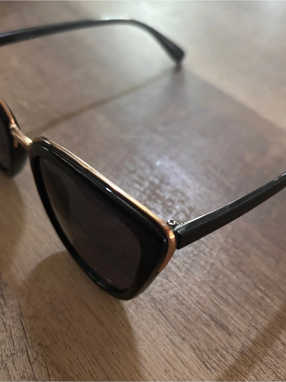 Black Oval Sunglasses with Gold Bridge
